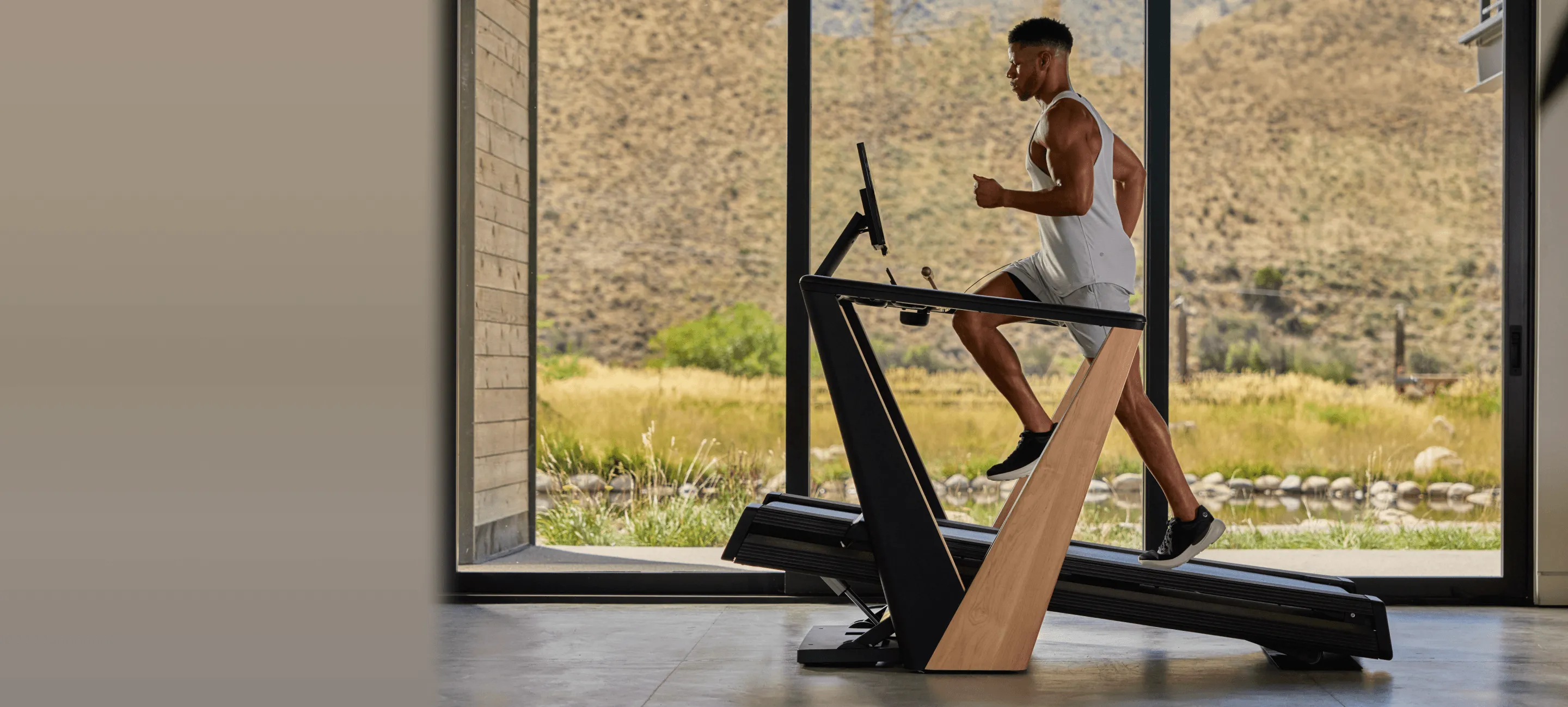 Athlete running on a treadmill in a modern gym setting